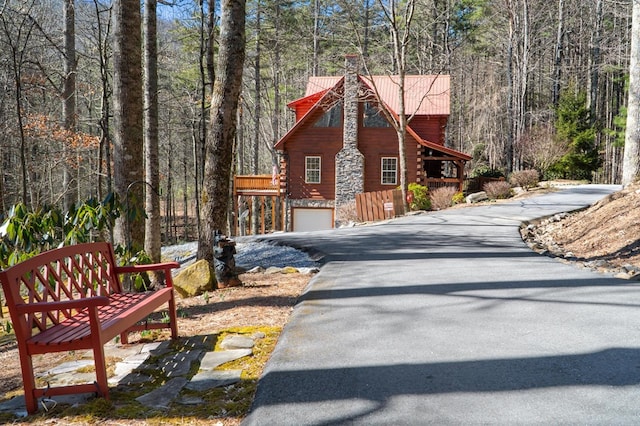 view of side of home with a garage