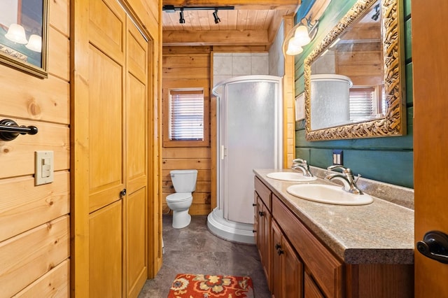 bathroom with toilet, wooden walls, walk in shower, wood ceiling, and vanity