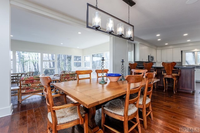 dining room with recessed lighting and dark wood-style flooring