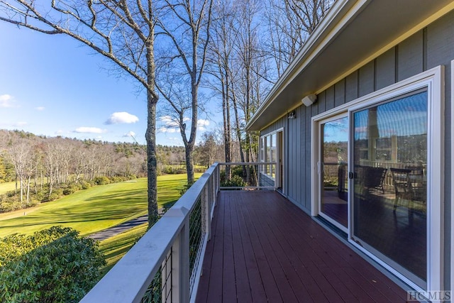 wooden deck with a yard