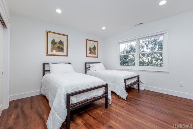 bedroom featuring dark hardwood / wood-style flooring