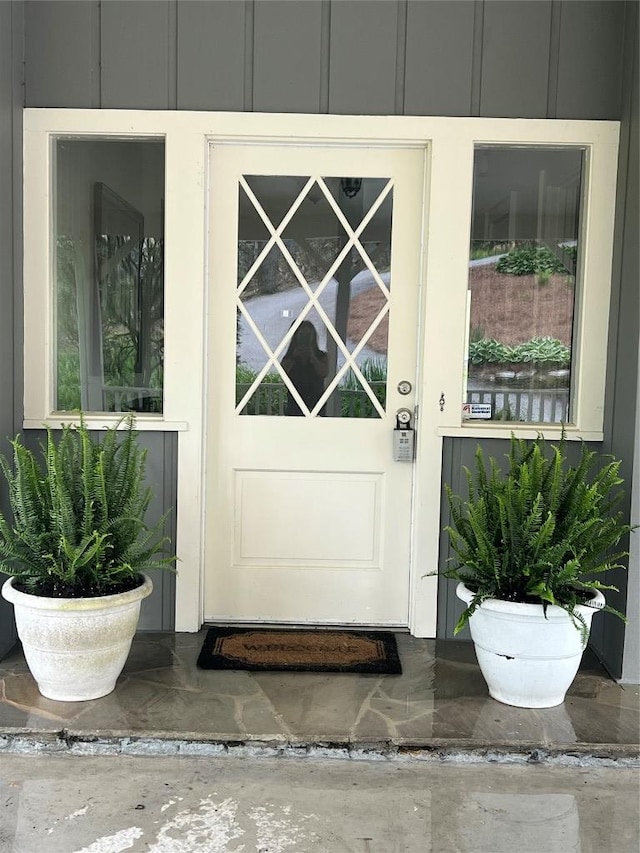 property entrance with board and batten siding