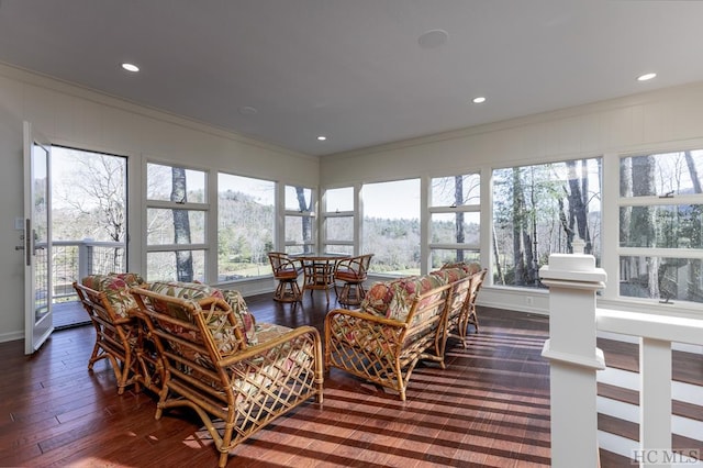 sunroom / solarium featuring ornamental molding, plenty of natural light, hardwood / wood-style floors, and recessed lighting