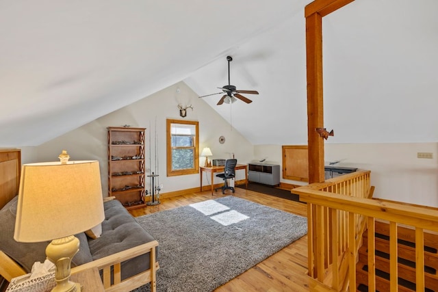 additional living space with lofted ceiling, wood finished floors, and baseboards