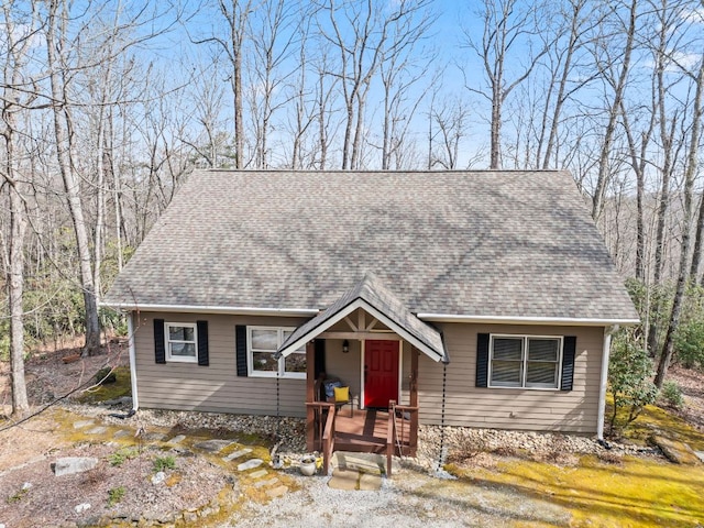 view of front of property featuring roof with shingles