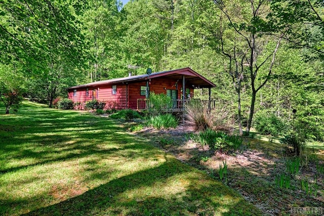 view of yard featuring covered porch