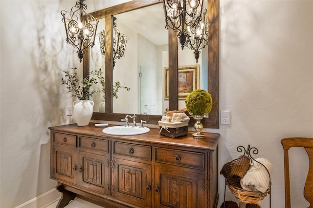 421 Easter Ln, Cullowhee, NC 28723 - bathroom featuring a chandelier and vanity