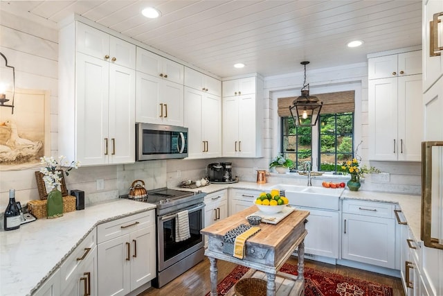 421 Easter Ln, Cullowhee, NC 28723 - kitchen featuring appliances with stainless steel finishes, white cabinets, recessed lighting, dark wood finished floors, and wood ceiling