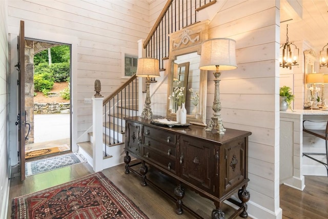 421 Easter Ln, Cullowhee, NC 28723 - entrance foyer featuring wood finished floors, wooden walls, stairs, and a chandelier