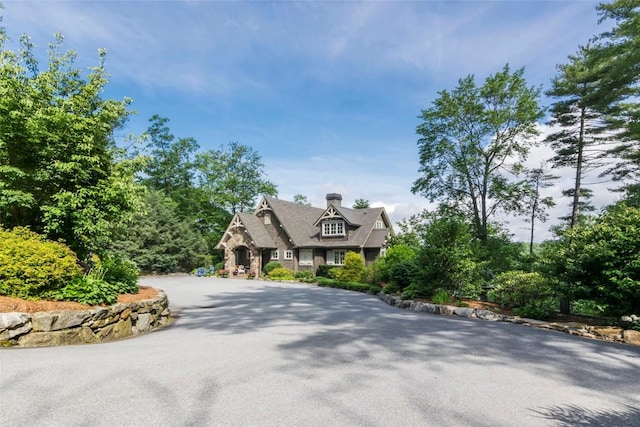 421 Easter Ln, Cullowhee, NC 28723 - view of front of house with a chimney and stone siding