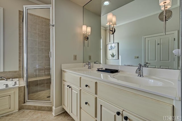 bathroom with plus walk in shower, tile patterned flooring, and vanity