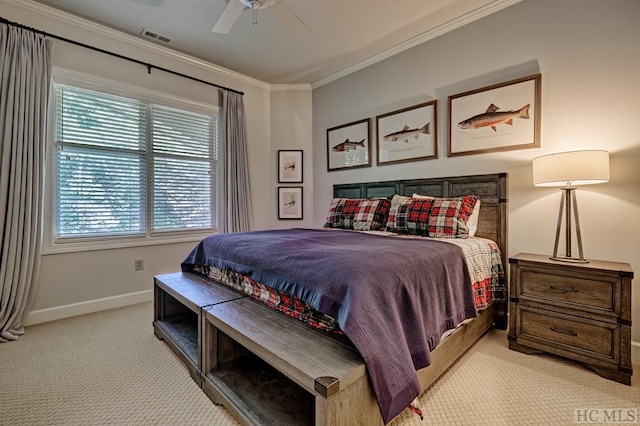 bedroom with ornamental molding, light colored carpet, and ceiling fan