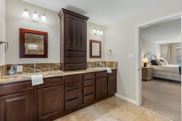 110 Kestrel Ct, Sapphire, NC 28774 - full bath featuring ensuite bath, double vanity, baseboards, and tile patterned flooring