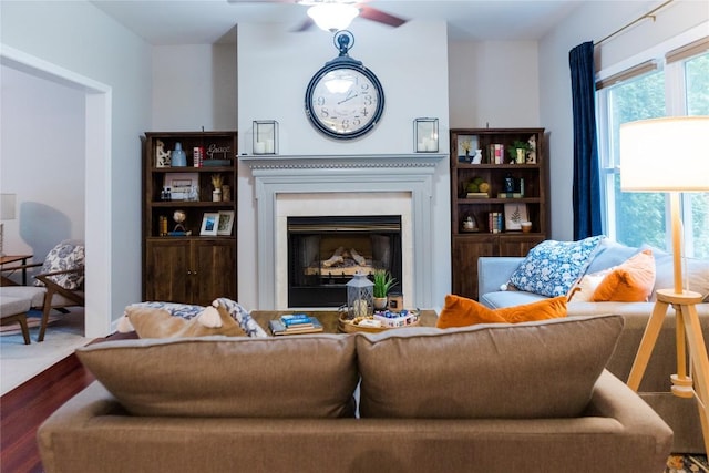 110 Kestrel Ct, Sapphire, NC 28774 - living area with wood finished floors, a glass covered fireplace, and a ceiling fan