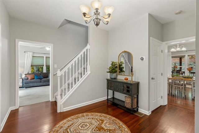 110 Kestrel Ct, Sapphire, NC 28774 - foyer featuring a chandelier, stairway, and wood finished floors
