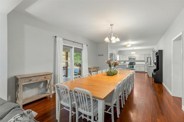 110 Kestrel Ct, Sapphire, NC 28774 - dining space with a chandelier, dark wood-style floors, and baseboards
