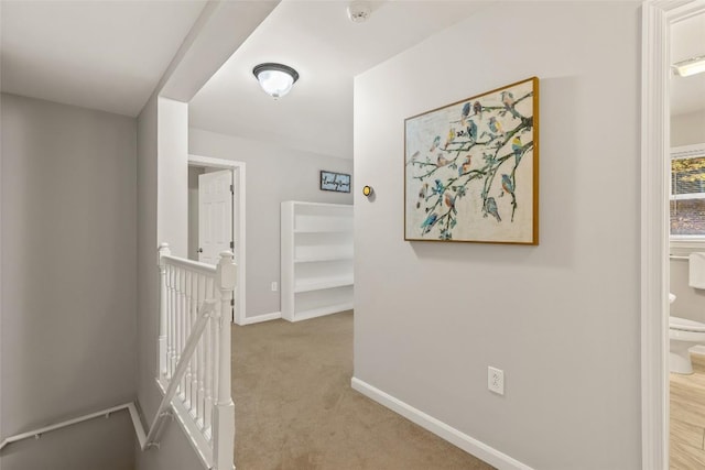 110 Kestrel Ct, Sapphire, NC 28774 - hall featuring an upstairs landing, baseboards, and light colored carpet
