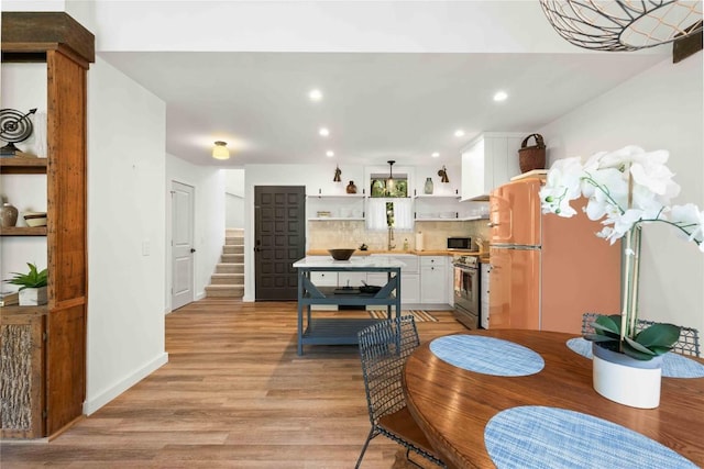 38 Lonely Mountain Dr Unit 24C, Sapphire, NC 28774 - dining room featuring recessed lighting, light wood finished floors, and stairs