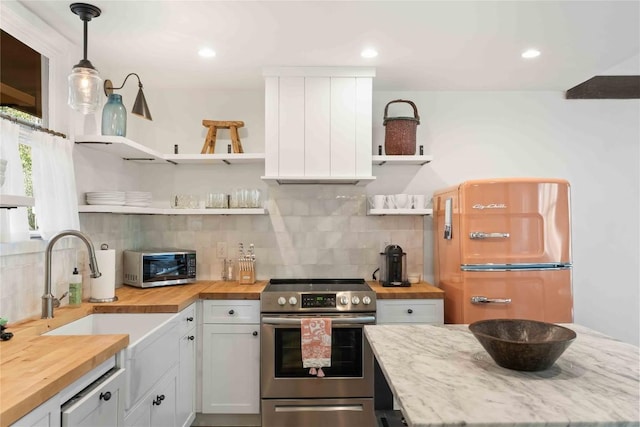 38 Lonely Mountain Dr Unit 24C, Sapphire, NC 28774 - kitchen featuring wooden counters, open shelves, stainless steel appliances, tasteful backsplash, and hanging light fixtures
