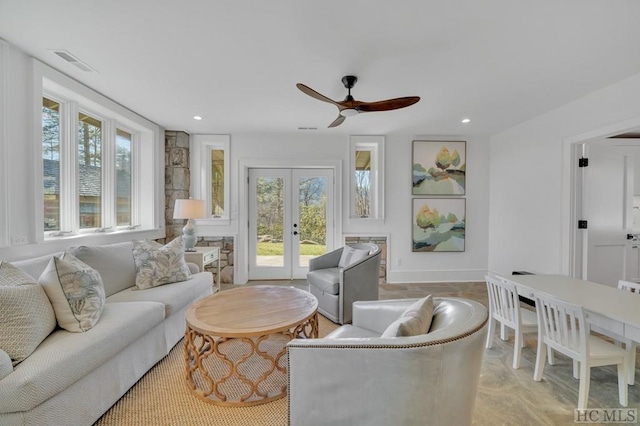 living room with french doors and ceiling fan