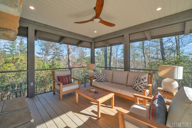 sunroom featuring wooden ceiling and ceiling fan