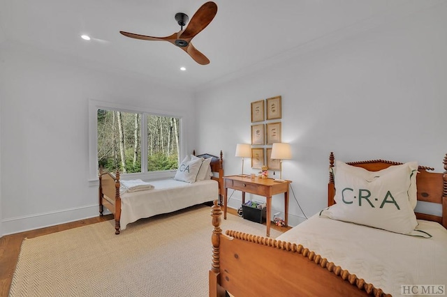 bedroom featuring ceiling fan and wood-type flooring