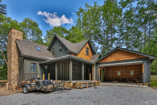 back of house featuring a sunroom