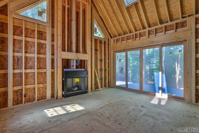 miscellaneous room featuring high vaulted ceiling