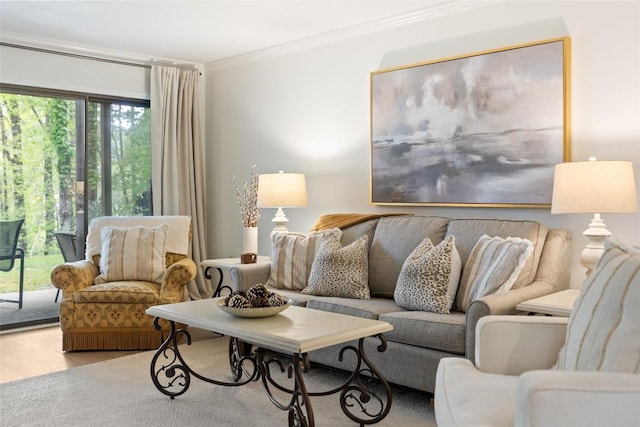 living area with crown molding and wood finished floors