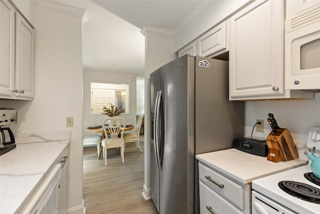 kitchen with light wood-style flooring, ornamental molding, white appliances, light stone counters, and white cabinets