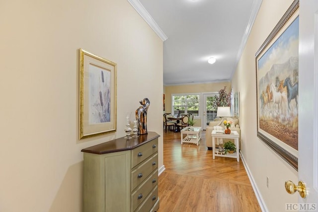 corridor featuring ornamental molding and light hardwood / wood-style flooring