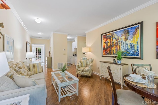 living room featuring ornamental molding and wood-type flooring