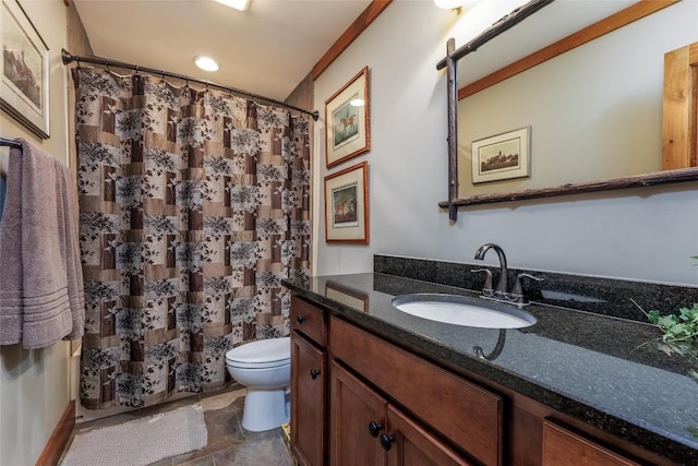 bathroom with curtained shower, vanity, and toilet