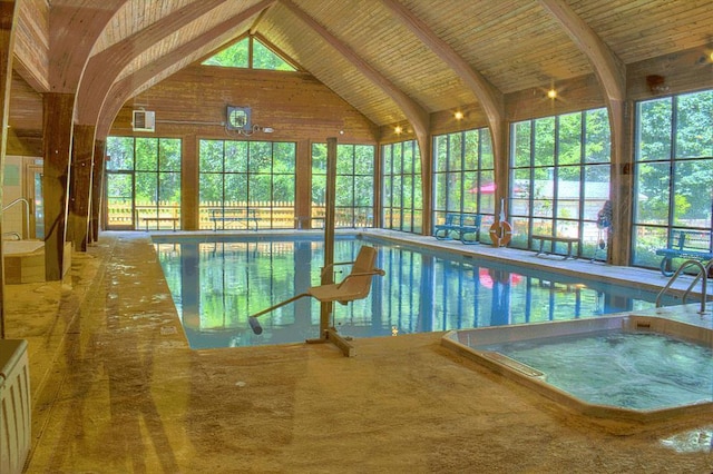 view of swimming pool with an indoor in ground hot tub