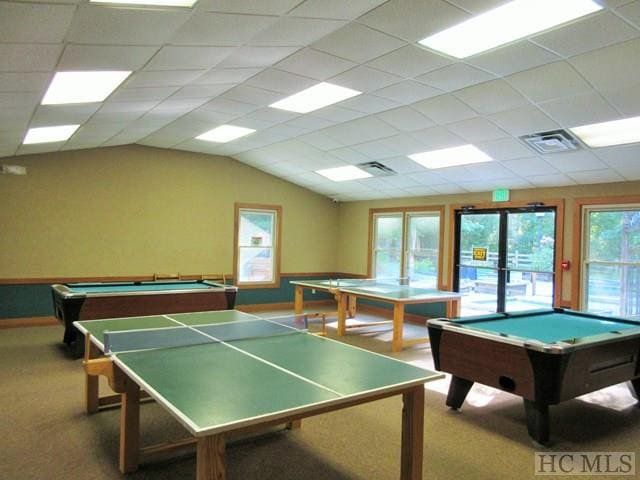 rec room featuring pool table, vaulted ceiling, visible vents, and carpet flooring