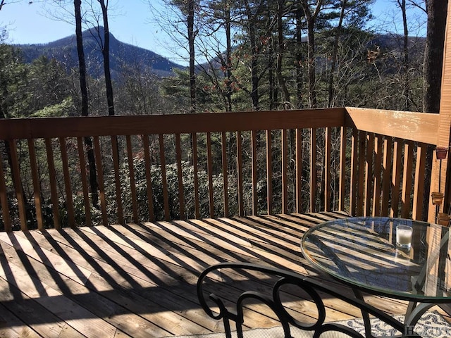 wooden deck featuring a mountain view