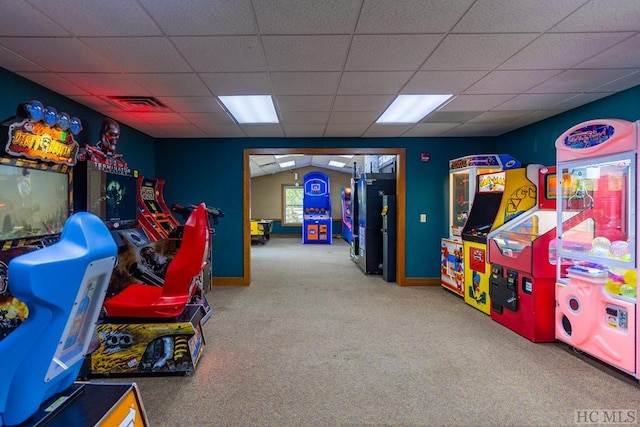 playroom featuring carpet and a drop ceiling