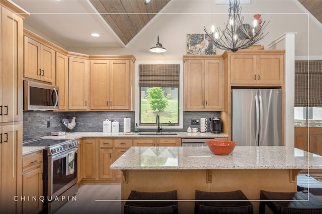 194 Redrock Trl, Glenville, NC 28736 - kitchen with tasteful backsplash, a kitchen breakfast bar, vaulted ceiling, appliances with stainless steel finishes, and a sink