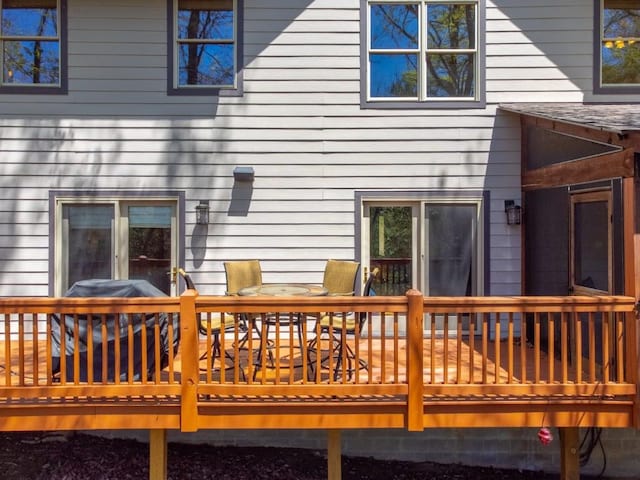 back of house with a wooden deck