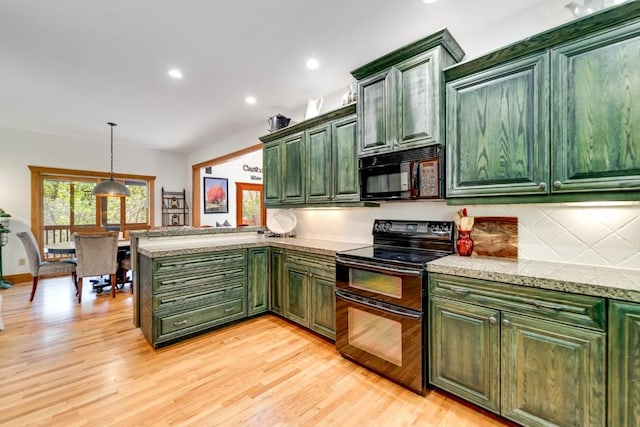 kitchen with black appliances, green cabinets, decorative backsplash, light wood finished floors, and recessed lighting
