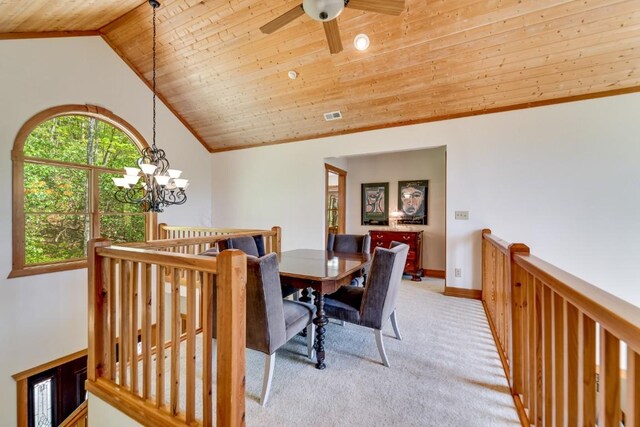 dining space featuring wooden ceiling, light carpet, vaulted ceiling, a chandelier, and ceiling fan