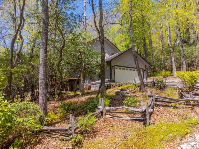 view of front of house featuring fence