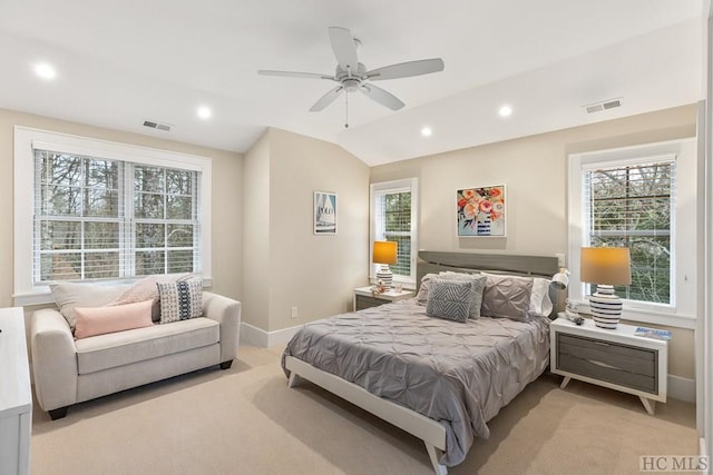 bedroom featuring light carpet, vaulted ceiling, and ceiling fan