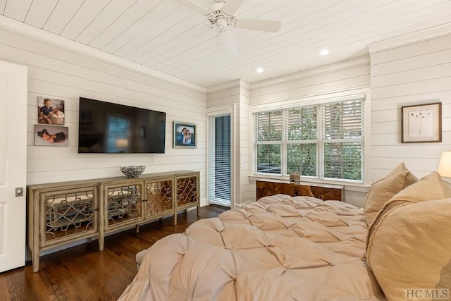 bedroom featuring dark hardwood / wood-style flooring, wood ceiling, wooden walls, and ceiling fan