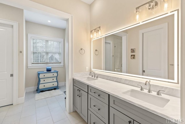 bathroom with vanity and tile patterned flooring