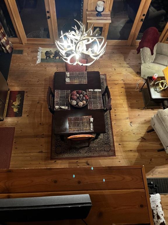 dining space with wood-type flooring