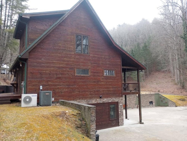 view of property exterior featuring ac unit and central AC