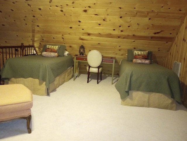 carpeted bedroom with wood walls