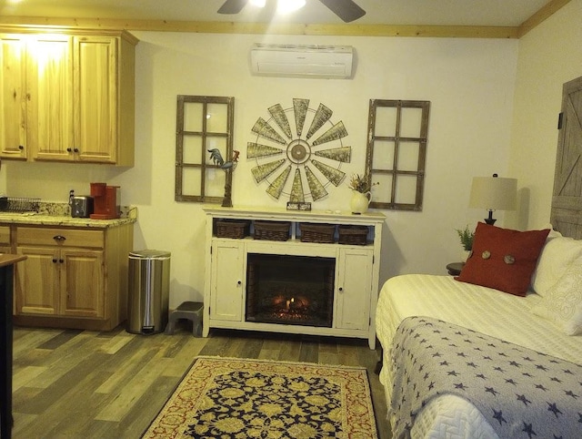 bedroom with ornamental molding, an AC wall unit, and dark hardwood / wood-style flooring