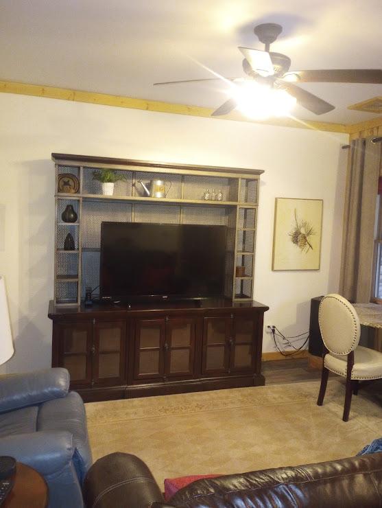 living room featuring ceiling fan